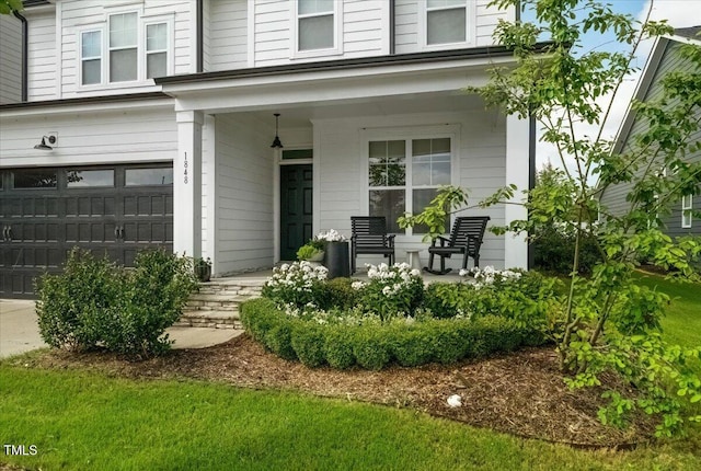 1848 Stagecoach Trl, Wendell, NC 27591 - view of exterior entry with covered porch and an attached garage