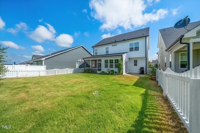 1848 Stagecoach Trl, Wendell, NC 27591 - rear view of house featuring a sunroom and a fenced backyard