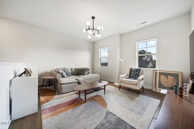 1848 Stagecoach Trl, Wendell, NC 27591 - living area featuring a chandelier and wood finished floors