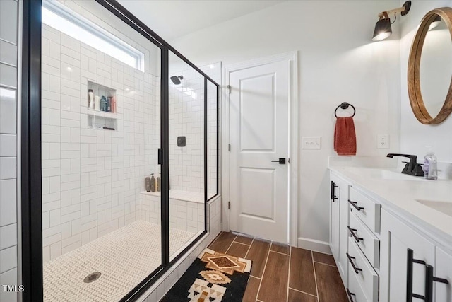 1848 Stagecoach Trl, Wendell, NC 27591 - bathroom featuring a stall shower, wood finish floors, and double vanity