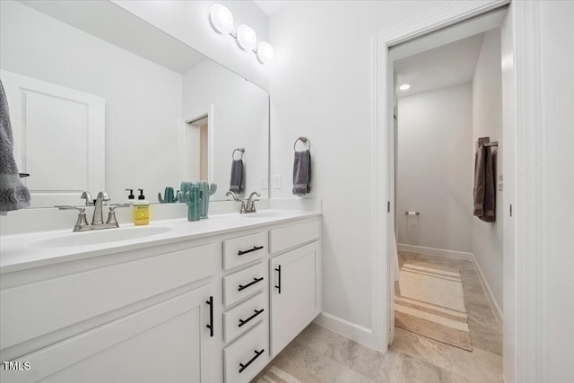 1848 Stagecoach Trl, Wendell, NC 27591 - bathroom with double vanity and baseboards