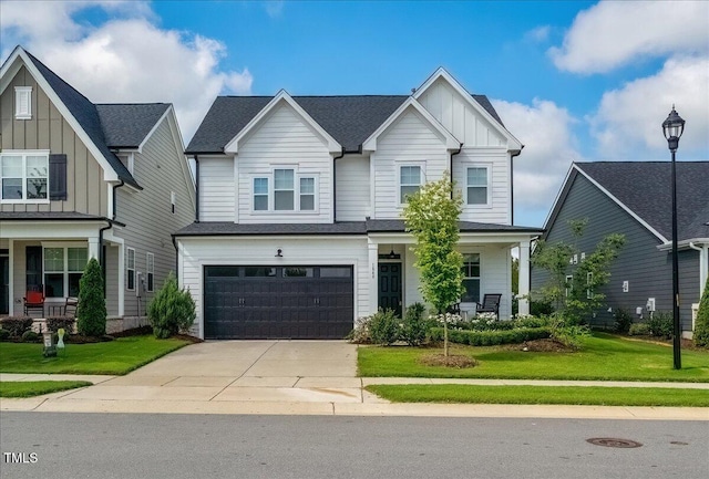 1848 Stagecoach Trl, Wendell, NC 27591 - craftsman-style home with board and batten siding, driveway, a front lawn, and an attached garage