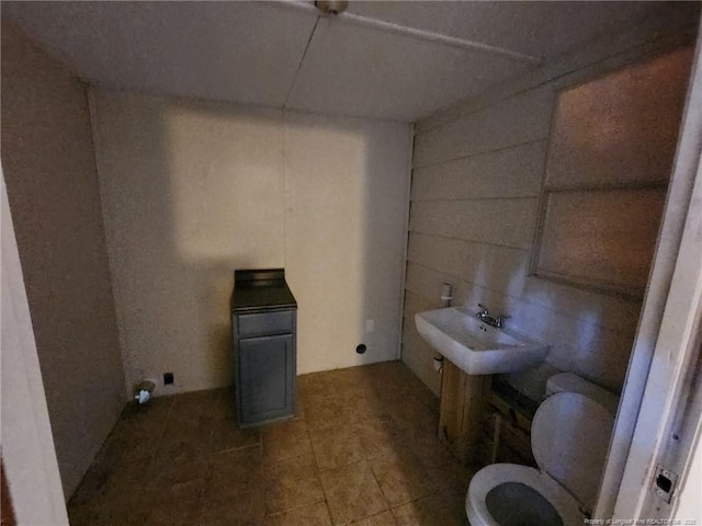 1227 E Martin Luther King Jr Dr, Maxton, NC 28364 - half bath featuring toilet and tile patterned floors