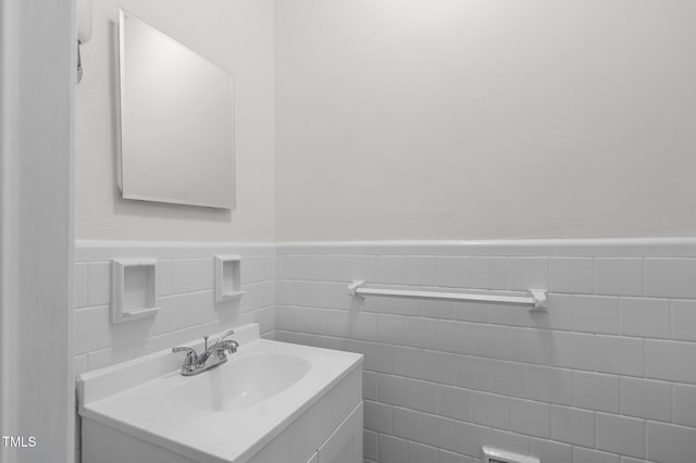 221 Whitfield St, Enfield, NC 27823 - bathroom with vanity, wainscoting, and tile walls