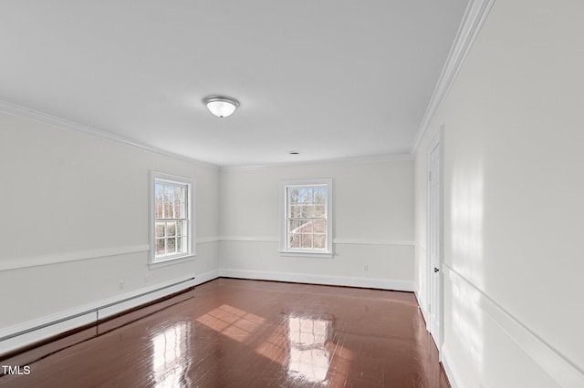 221 Whitfield St, Enfield, NC 27823 - spare room featuring a baseboard radiator, wood finished floors, and crown molding