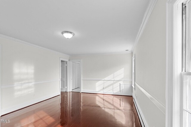 221 Whitfield St, Enfield, NC 27823 - unfurnished room featuring crown molding, a baseboard radiator, and wood finished floors