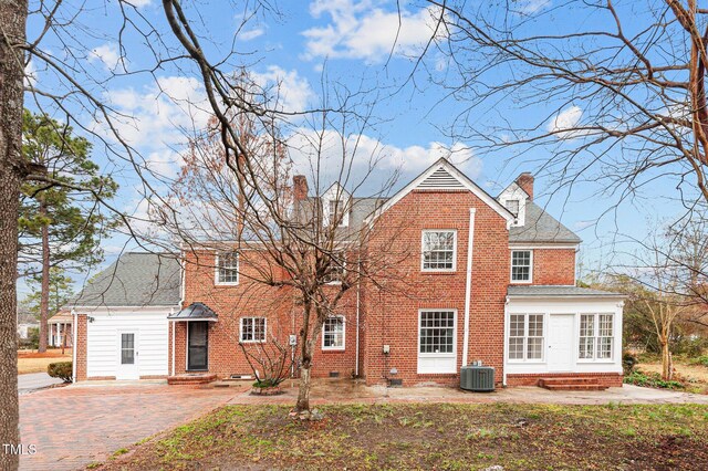 221 Whitfield St, Enfield, NC 27823 - back of house with a chimney, brick siding, entry steps, crawl space, and roof with shingles