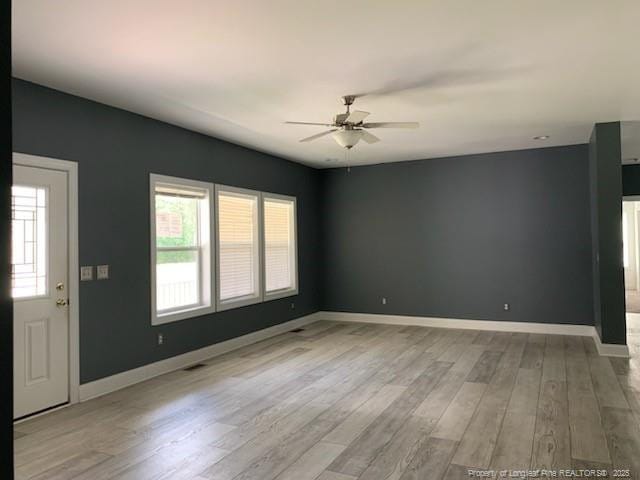 1484 Brayboy Rd, Rowland, NC 28383 - unfurnished living room featuring a ceiling fan and light wood finished floors
