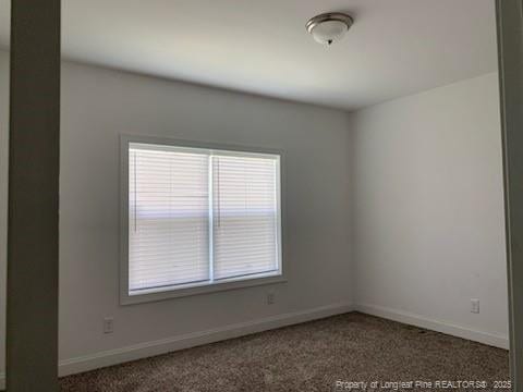 1484 Brayboy Rd, Rowland, NC 28383 - carpeted spare room featuring baseboards