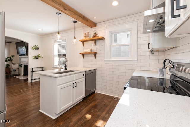 415 W Carver St, Durham, NC 27704 - kitchen with appliances with stainless steel finishes, exhaust hood, dark wood-style floors, arched walkways, and white cabinetry