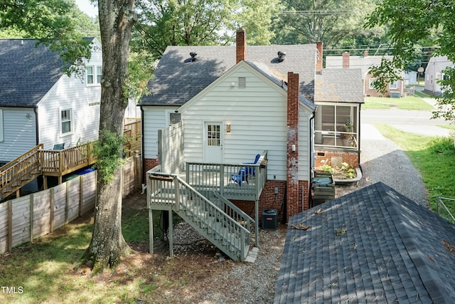 415 W Carver St, Durham, NC 27704 - rear view of property with stairs, a deck, a sunroom, a chimney, and a shingled roof