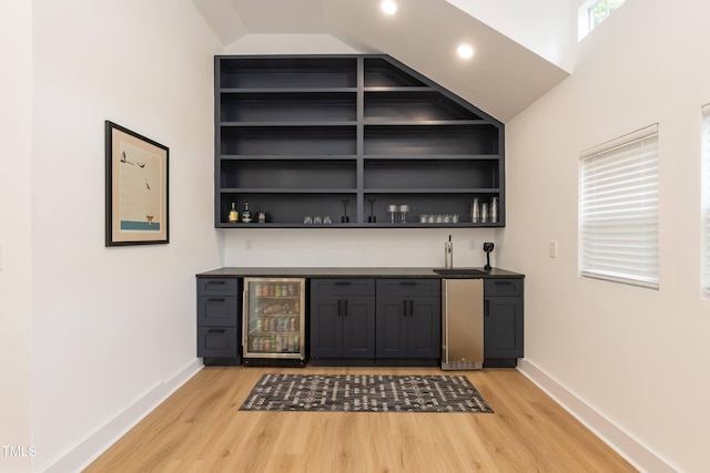 415 W Carver St, Durham, NC 27704 - indoor wet bar featuring beverage cooler, light wood-style flooring, vaulted ceiling, and recessed lighting