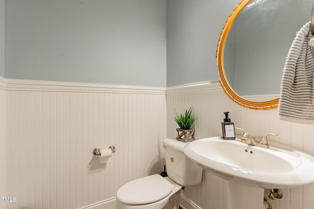 2407 Cattail Pond Dr, Zebulon, NC 27597 - half bath featuring toilet and wainscoting