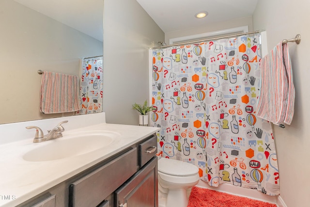 2407 Cattail Pond Dr, Zebulon, NC 27597 - bathroom with vanity, a shower with curtain, and recessed lighting