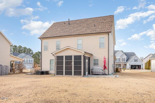 2407 Cattail Pond Dr, Zebulon, NC 27597 - back of house featuring a sunroom