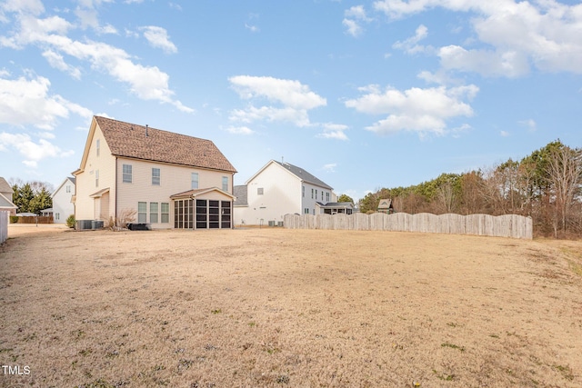 2407 Cattail Pond Dr, Zebulon, NC 27597 - rear view of property with a sunroom