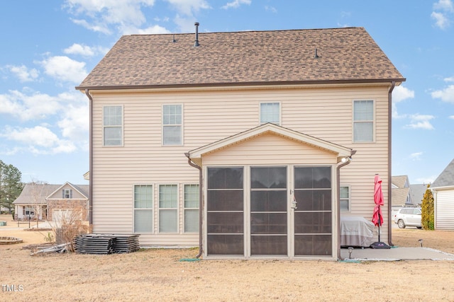2407 Cattail Pond Dr, Zebulon, NC 27597 - back of house featuring a sunroom and roof with shingles