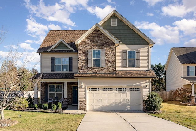 2407 Cattail Pond Dr, Zebulon, NC 27597 - craftsman-style home featuring stone siding, concrete driveway, an attached garage, and roof with shingles