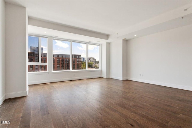 400 W N St Unit 732, Raleigh, NC 27603 - unfurnished room with wood finished floors, recessed lighting, and a city view