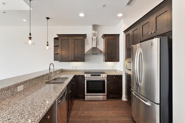 400 W N St Unit 732, Raleigh, NC 27603 - kitchen featuring stainless steel appliances, wall chimney range hood, dark brown cabinetry, dark wood-style flooring, and recessed lighting