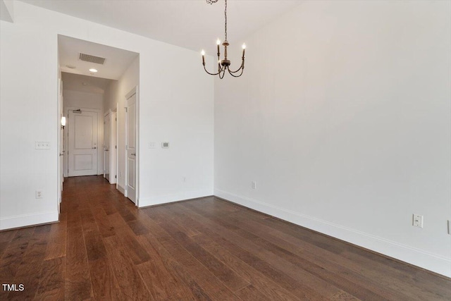 400 W N St Unit 732, Raleigh, NC 27603 - empty room featuring a chandelier and dark wood-type flooring