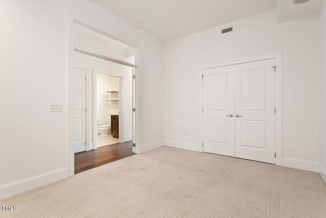 400 W N St Unit 732, Raleigh, NC 27603 - unfurnished bedroom featuring carpet flooring and a closet