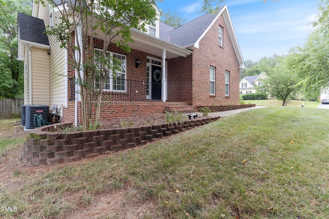 8508 Parlange Woods Ln, Wake Forest, NC 27587 - view of front facade featuring brick siding, a front yard, a porch, and a shingled roof