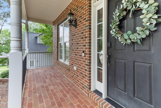 8508 Parlange Woods Ln, Wake Forest, NC 27587 - property entrance with covered porch and brick siding