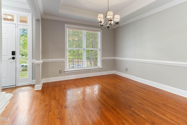 8508 Parlange Woods Ln, Wake Forest, NC 27587 - foyer with a chandelier, hardwood / wood-style floors, ornamental molding, and a tray ceiling
