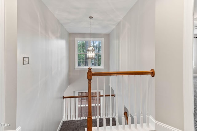 8508 Parlange Woods Ln, Wake Forest, NC 27587 - stairway with baseboards and a chandelier