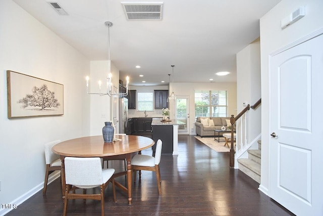 21 Intuition Cir, Durham, NC 27705 - dining room with stairs, dark wood finished floors, and recessed lighting