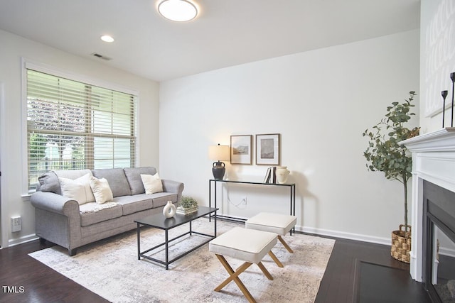 21 Intuition Cir, Durham, NC 27705 - living room with wood finished floors, a glass covered fireplace, and recessed lighting