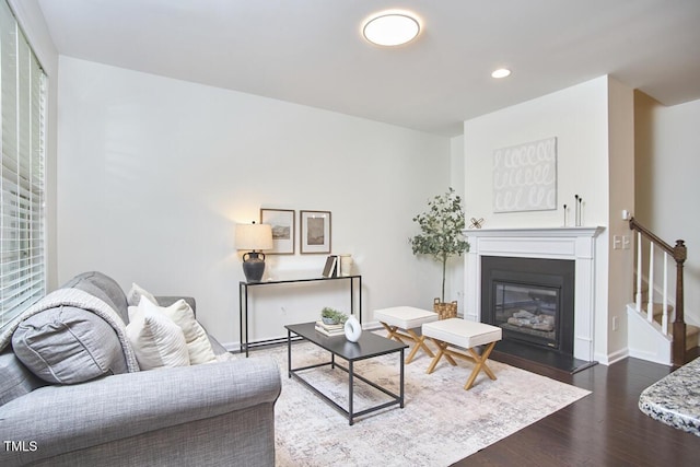 21 Intuition Cir, Durham, NC 27705 - living room with wood finished floors, a glass covered fireplace, recessed lighting, and stairway