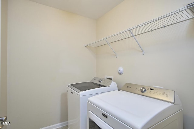 21 Intuition Cir, Durham, NC 27705 - laundry room featuring separate washer and dryer and baseboards
