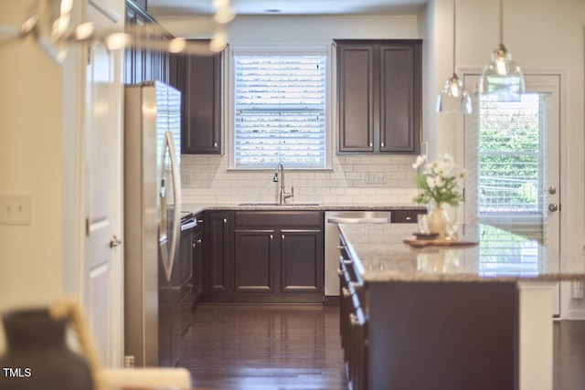 21 Intuition Cir, Durham, NC 27705 - kitchen featuring stainless steel appliances, a center island, tasteful backsplash, and healthy amount of natural light