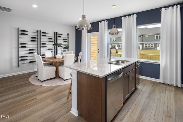 1516 Tamarisk Ln, Durham, NC 27703 - kitchen with dishwasher, light wood-type flooring, plenty of natural light, and recessed lighting