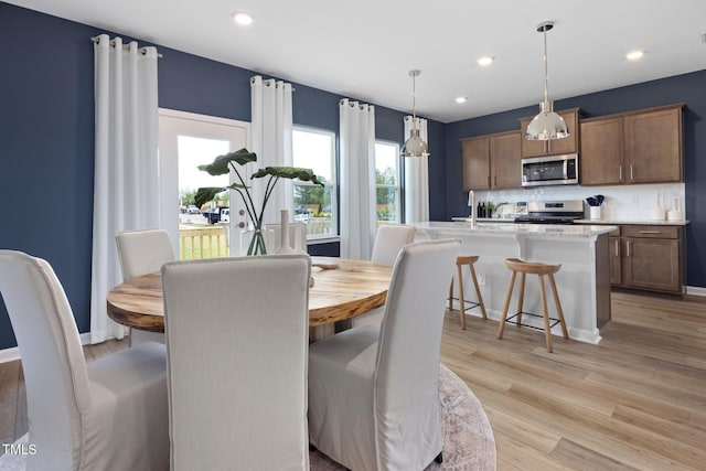 1516 Tamarisk Ln, Durham, NC 27703 - dining area featuring light wood-style flooring and recessed lighting