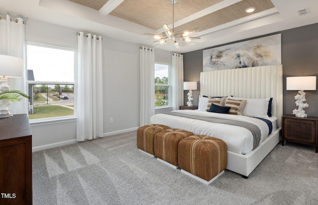 1516 Tamarisk Ln, Durham, NC 27703 - carpeted bedroom featuring a raised ceiling, multiple windows, a wood ceiling with exposed beams, and recessed lighting