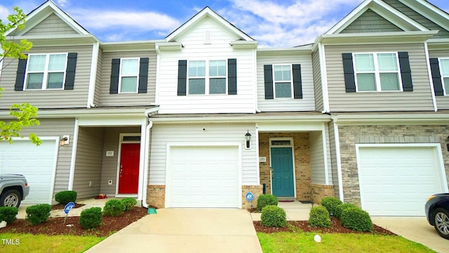 103 Liam St Unit 108, Clayton, NC 27520 - multi unit property with an attached garage, brick siding, and concrete driveway