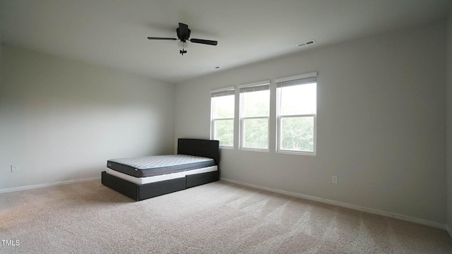 103 Liam St Unit 108, Clayton, NC 27520 - carpeted bedroom featuring baseboards and ceiling fan