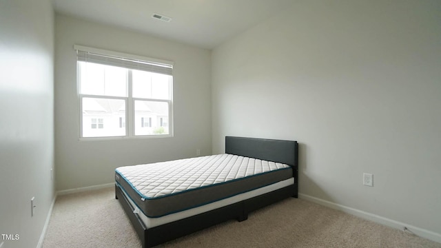 103 Liam St Unit 108, Clayton, NC 27520 - carpeted bedroom featuring multiple windows