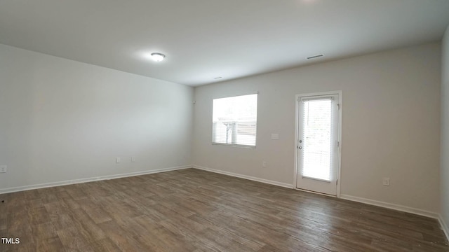 103 Liam St Unit 108, Clayton, NC 27520 - spare room with dark wood finished floors and baseboards