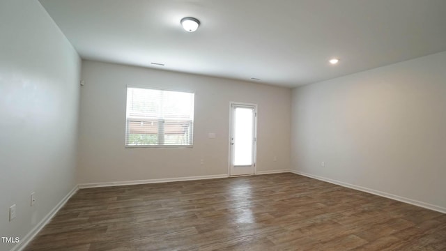 103 Liam St Unit 108, Clayton, NC 27520 - empty room with dark wood-type flooring and recessed lighting