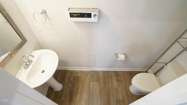103 Liam St Unit 108, Clayton, NC 27520 - bathroom featuring toilet and wood finished floors