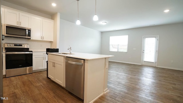 103 Liam St Unit 108, Clayton, NC 27520 - kitchen with appliances with stainless steel finishes, backsplash, dark wood finished floors, light countertops, and recessed lighting