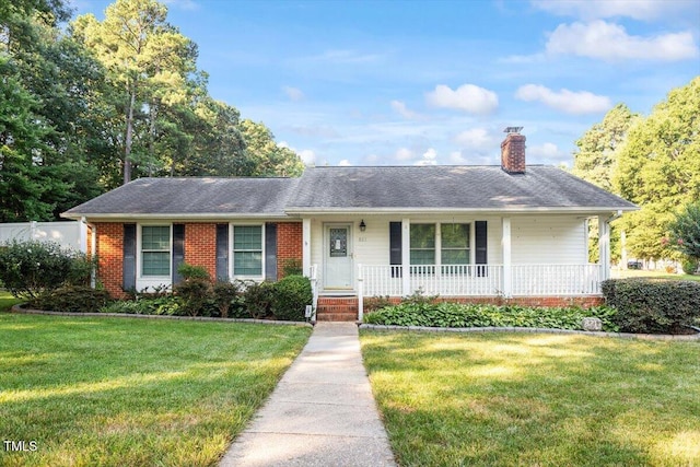 821 Northclift Dr, Raleigh, NC 27609 - ranch-style home with a front lawn, a porch, a chimney, and brick siding