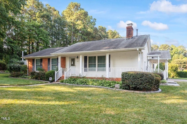 821 Northclift Dr, Raleigh, NC 27609 - single story home featuring covered porch, a chimney, a front lawn, and brick siding
