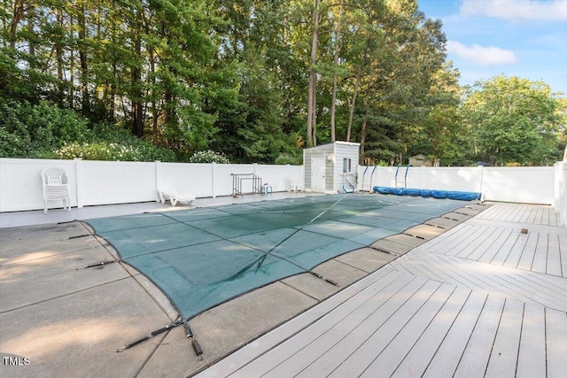 821 Northclift Dr, Raleigh, NC 27609 - view of swimming pool with a wooden deck and view of wooded area