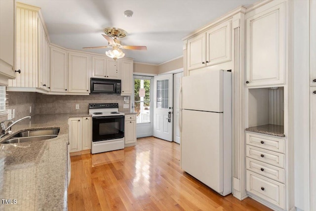 821 Northclift Dr, Raleigh, NC 27609 - kitchen featuring black microwave, range with electric stovetop, freestanding refrigerator, ceiling fan, and decorative backsplash