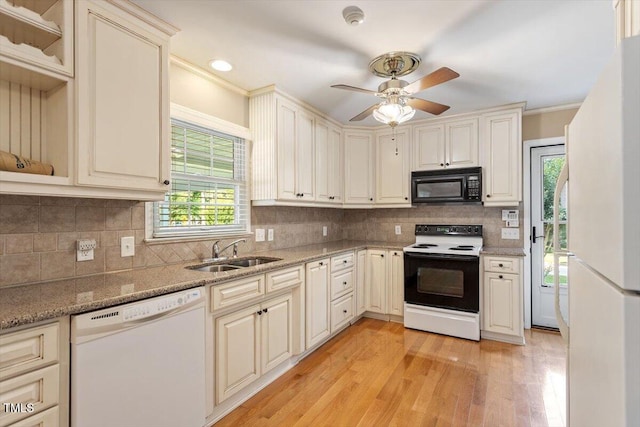 821 Northclift Dr, Raleigh, NC 27609 - kitchen featuring white appliances, light wood-type flooring, a ceiling fan, light stone counters, and decorative backsplash